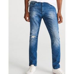 Jeansy slim z bawełny organicznej - Niebieski. Jeansy męskie Reserved. W wyprzedaży za 79.99 zł.