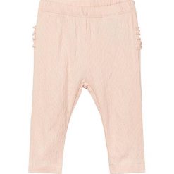 Spodnie "Deisse" w kolorze brzoskwiniowym. Spodenki niemowlęce marki name it girls. W wyprzedaży za 29.95 zł.
