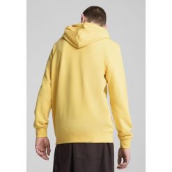 Męska bluza z kapturem Essentials z dwukolorowym logo No. 1 PUMA Sunny Yellow. Żółte bluzy męskie Puma, m, bez wzorów, z gumy, z kapturem, do biegania. Za 207.65 zł.