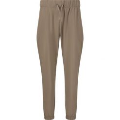 Damskie spodnie dresowe Athlecia Austberg. Brązowe obuwie sportowe damskie Athlecia, bez wzorów, z dresówki. Za 193.50 zł.