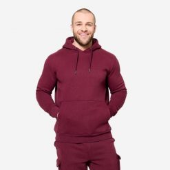 Bluza z kapturem męska Domyos Gym & Pilates. Fioletowe bluzy męskie DOMYOS, l, bez wzorów, z materiału, z kapturem. Za 129.99 zł.