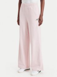Lacoste Spodnie dresowe XF8392 Różowy jasny Regular Fit. Czerwone spodnie dresowe damskie Lacoste, bez wzorów, z bawełny. Za 594.99 zł.