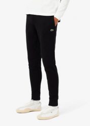 Spodnie dresowe bawełniane Lacoste. Czarne spodnie sportowe męskie Lacoste, m, bez wzorów, z bawełny, na fitness i siłownię. Za 412.85 zł.