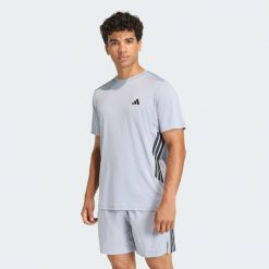 Koszulka Tech Essentials Workout 3 Stripes. Szare koszulki sportowe męskie Adidas, bez wzorów, bez kołnierzyka, bez ramiączek, na fitness i siłownię, climacool (adidas). Za 179.00 zł.