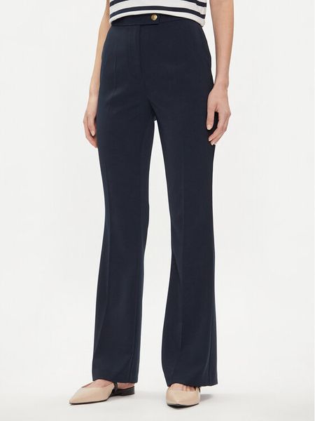 Tommy Hilfiger Spodnie materiałowe Gold Button WW0WW42455 Granatowy Flare Fit. Niebieskie spodnie materiałowe damskie Tommy Hilfiger, bez wzorów, z materiału. Za 349.99 zł.