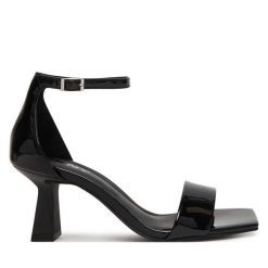 Sandały DKNY. Czarne sandały damskie DKNY, bez wzorów, bez obcasa, na słupku, bez zapięcia. Za 579.99 zł.