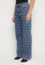 Niebieskie Jeansy o Szerokim Kroju z Wysokim Stanem i Ozdobnym Nadrukiem Evellexa. Niebieskie spodnie sportowe damskie Born2be, l, bez wzorów, z jeansu, trekkingowe. Za 139.99 zł.