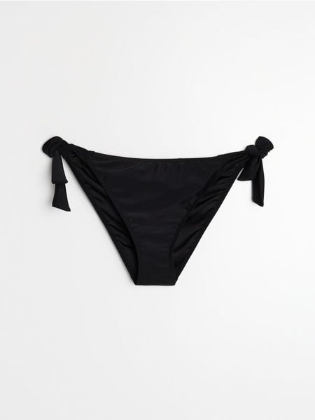 Dół od bikini wiązany po bokach - czarny. Czarne bikini damskie Sinsay, l, bez wzorów. Za 15.99 zł.
