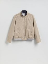 Kurtka bomberka ze stójką - beżowy. Brązowe kurtki męskie Reserved, l, bez wzorów, z bawełny, bez kaptura. Za 159.99 zł.