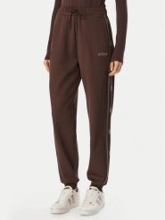 Guess Spodnie dresowe V5BB23 KCX22 Brązowy Regular Fit. Brązowe spodnie dresowe damskie Guess, xs, z aplikacjami, z dresówki. Za 474.99 zł.