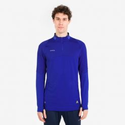 Bluza piłkarska Kipsta CLR półsuwak. Niebieskie bluzy męskie KIPSTA, l, bez wzorów, z materiału, bez kaptura, na fitness i siłownię. Za 129.99 zł.