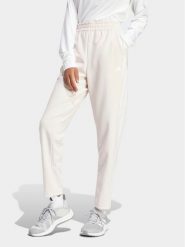 Adidas Spodnie dresowe Train Essentials IS3969 Różowy Loose Fit. Czerwone spodnie dresowe damskie Adidas, m, bez wzorów, z dresówki. Za 129.99 zł.