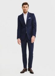 PAKO LORENTE – Wełniane spodnie garniturowe w kolorze granatowym. Eleganckie spodnie męskie Pako Lorente, m, bez wzorów, z wełny. Za 799.99 zł.