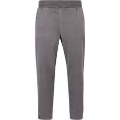Grube joggery z rozcięciem, barwione w dresie Urban Classics. Czarne spodnie materiałowe męskie Urban Classics, m, bez wzorów, z dresówki. Za 275.00 zł.