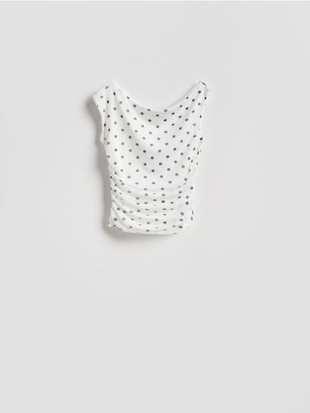 Bluzka w groszki - wielobarwny. Bluzki damskie Reserved, l, bez wzorów, z dzianiny, bez kołnierzyka, bez ramiączek. Za 69.99 zł.
