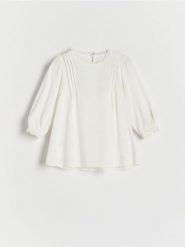 Sukienka z wiskozy - złamana biel. Sukienki niemowlęce Reserved, bez wzorów, z wiskozy, bez ramiączek. W wyprzedaży za 39.99 zł.