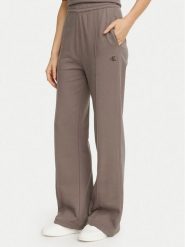 Calvin Klein Jeans Spodnie dresowe Monogram LV047H220G Beżowy ciemny Flare Fit. Brązowe jeansy damskie Calvin Klein Jeans. Za 369.99 zł.