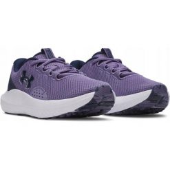 Buty do biegania damskie Under Armour UA Charged Surge 4 3027007-520. Fioletowe obuwie sportowe damskie Under Armour, bez wzorów, do biegania. Za 179.99 zł.