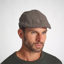 Kaszkiet outdoor tweedowy Solognac. Brązowe czapki i kapelusze męskie SOLOGNAC, bez wzorów, z bawełny, sportowe. Za 39.99 zł.