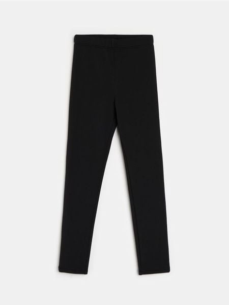 Legginsy z futerkowym ociepleniem w środku - czarny. Czarne legginsy damskie Sinsay, l, bez wzorów. W wyprzedaży za 19.99 zł.