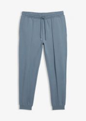 Eleganckie spodnie dresowe ze szczypanką z miękkiej mieszanki bawełny. Niebieskie eleganckie spodnie męskie bonprix, m, bez wzorów, z bawełny. Za 119.99 zł.