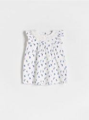 Sukienka we wzór - złamana biel. Sukienki niemowlęce Reserved, bez wzorów, z bawełny, bez ramiączek. W wyprzedaży za 19.99 zł.