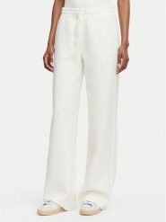 Guess Spodnie dresowe V6YB10 K4295 Kremowy Regular Fit. Białe spodnie dresowe damskie Guess, xs, z aplikacjami, z dresówki. Za 344.99 zł.