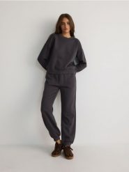 Dresowe spodnie jogger z bawełną - ciemnoszary. Szare spodnie dresowe damskie Reserved, l, bez wzorów, z bawełny. W wyprzedaży za 69.99 zł.