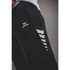 Spodnie dresowe Erima Cmpt Wings czarne. Czarne spodnie sportowe męskie 55PROTEC, s, bez wzorów, z bawełny, na fitness i siłownię. Za 263.25 zł.