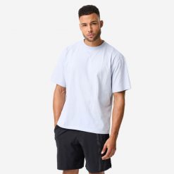 Koszulka do treningu siłowego męska Domyos. Niebieskie koszulki sportowe męskie DOMYOS, m, bez wzorów, z bawełny, bez kołnierzyka, bez ramiączek, na fitness i siłownię. Za 69.99 zł.