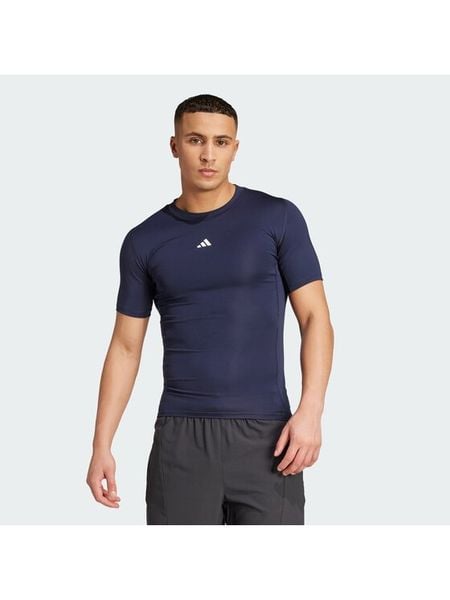 Adidas Koszulka techniczna TECHFIT Compression Training JX2561 Granatowy Slim Fit. Niebieskie koszulki sportowe męskie Adidas, m, bez wzorów, z syntetyku, bez kołnierzyka, bez ramiączek, na fitness i siłownię, techfit (adidas). Za 122.99 zł.
