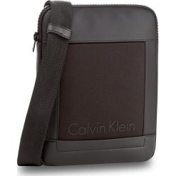 Saszetka CALVIN KLEIN - Caillou Flat Crosso K50K502835 001. Czarne saszetki męskie marki Calvin Klein, z materiału, młodzieżowe. W wyprzedaży za 209.00 zł.