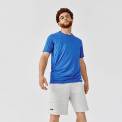 Koszulka do biegania męska Kipruni Dry+. Żółte koszulki sportowe męskie KIPRUN, m, bez wzorów, z elastanu, bez kołnierzyka, bez ramiączek, do biegania. W wyprzedaży za 19.99 zł.