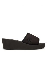Calvin Klein Jeans Klapki Beach Wedge Slide Canvas YW0YW01725 Czarny. Czarne klapki damskie Calvin Klein Jeans, bez wzorów, z jeansu, bez obcasa. Za 139.99 zł.