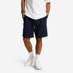 Spodenki fitness męskie Domyos. Niebieskie buty sportowe męskie DOMYOS, z materiału, bez zapięcia, na fitness i siłownię. Za 69.99 zł.