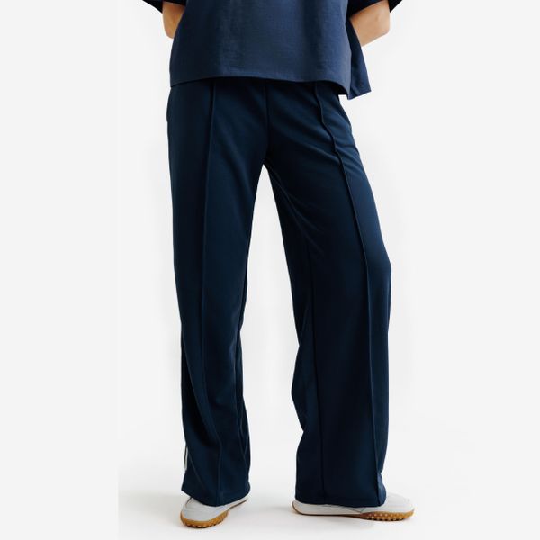 Spodnie dresowe damskie Heritage. Niebieskie spodnie dresowe damskie Decathlon, l, bez wzorów, z dresówki. Za 89.99 zł.