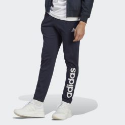 Spodnie dresowe męskie adidas Essentials Single Jersey Tapered Elasticized Cuff. Niebieskie buty sportowe męskie Adidas, m, bez wzorów, z dresówki, na fitness i siłownię. Za 157.99 zł.
