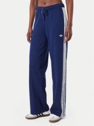 Adidas Spodnie dresowe Firebird KW2605 Niebieski Regular Fit. Niebieskie spodnie dresowe damskie Adidas, m, bez wzorów, z dresówki. Za 349.99 zł.