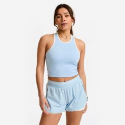 Koszulka fitness damska Domyos bez rękawów. Niebieskie koszulki sportowe damskie DOMYOS, bez wzorów, z elastanu, na fitness i siłownię. Za 49.99 zł.