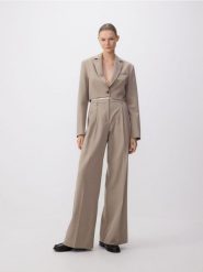 Spodnie z kontrastową wstawką - beżowy. Brązowe spodnie materiałowe damskie Reserved, l, bez wzorów, z tkaniny. W wyprzedaży za 119.99 zł.