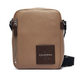 Saszetka Calvin Klein. Brązowe saszetki męskie Calvin Klein, młodzieżowe, małe. Za 369.99 zł.
