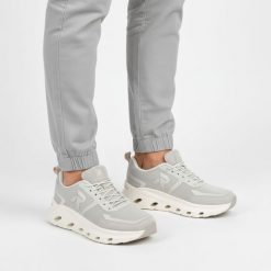 Sneakersy damskie Rieker, nowoczesna forma z lekkiej oddychającej cholewki zapewniająca wygodę amortyzowana podeszwa sportowy charakter, szare, W3504. Szare półbuty damskie Rieker, bez wzorów, sportowe, bez obcasa, bez zapięcia. Za 399.00 zł.