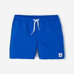 Spodenki surfingowe dla dzieci Olaian 100 teksturowane. Niebieskie szorty dla chłopców OLAIAN, bez wzorów, z materiału, sportowe. W wyprzedaży za 24.99 zł.