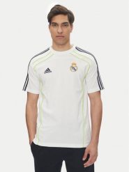 Adidas Koszulka techniczna Real Madrid UBP JF2591 Biały Regular Fit. Białe koszulki sportowe męskie Adidas, m, bez wzorów, z syntetyku, bez kołnierzyka, bez ramiączek, do piłki nożnej. Za 139.99 zł.