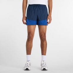 Spodenki męskie New Balance MB6176MRNNY – granatowe. Niebieskie krótkie spodenki sportowe męskie New Balance, l, bez wzorów, z materiału, na fitness i siłownię. Za 259.99 zł.