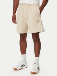 Adidas Szorty sportowe Adidas Kit 3-Stripes KW2385 Beżowy Loose Fit. Brązowe krótkie spodenki sportowe męskie Adidas, m, bez wzorów, z bawełny. Za 169.99 zł.