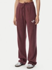 Adidas Spodnie dresowe Essentials IA4436 Bordowy Loose Fit. Czerwone spodnie dresowe damskie Adidas, s, bez wzorów, z dresówki. Za 298.99 zł.
