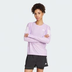 Koszulka Own The Run Long Sleeve. Czerwone koszulki sportowe damskie Adidas, s, bez wzorów, z elastanu, bez kołnierzyka, bez ramiączek, do biegania. Za 260.00 zł.