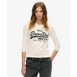 Top graficzny z długim rękawem Vl ozdobiony. Białe bielizna termoaktywna damska Superdry., bez wzorów, bez ramiączek, długie. W wyprzedaży za 158.65 zł.