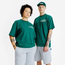 Koszulka z grafiką. Zielone t-shirty damskie Decathlon, xl, bez wzorów, z bawełny, bez kołnierzyka. W wyprzedaży za 59.99 zł.